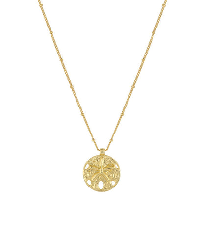 Serene Scenes The Label 18K gold-filled Sand Dollar Necklace. Gold chain with circular pendant featuring starfish and textured design.